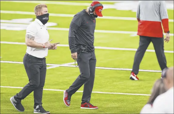  ?? Erik Verduzco Las Vegas Review-Journal @Erik_Verduzco ?? First-year Rebels coach Marcus Arroyo, center, is 0-3 after a 40-27 loss Saturday to Fresno State at Allegiant Stadium.