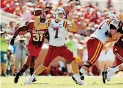  ?? [PHOTO BY STEVE SISNEY, THE OKLAHOMAN] ?? Iowa State’s Joel Lanning gets ready to throw the ball during an Oct. 7 game against Oklahoma. Lanning is a rare two-way player. He’s also a linebacker for the Cyclones.