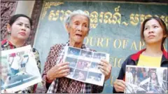  ?? PHA LINA ?? Nget Khun and fellow Boeung Kak activists stand outside the Appeal Court, which on Wednesday rejected a plea to reopen an investigat­ion into a 2013 attack on a peace vigil.