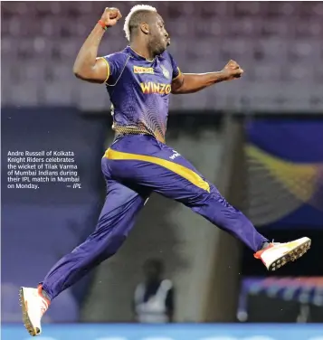  ?? — IPL ?? Andre Russell of Kolkata Knight Riders celebrates the wicket of Tilak Varma of Mumbai Indians during their IPL match in Mumbai on Monday.