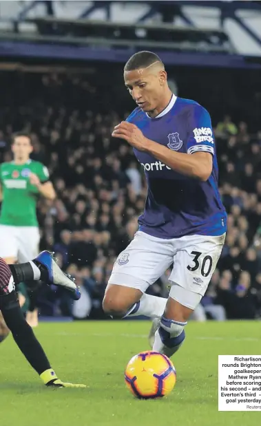  ?? Reuters ?? Richarliso­n rounds Brighton goalkeeper Mathew Ryan before scoring his second – and Everton’s third – goal yesterday