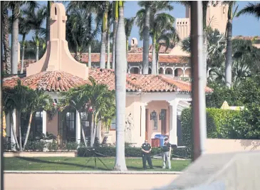  ??  ?? JUST ANOTHER DAY: Police await President Donald Trump’s arrival at Mar-a-Lago in Palm Beach, Florida.