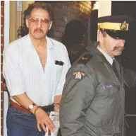  ?? ANDREW VAUGHAN / THE CANADIAN PRESS FILES ?? Allan Legere departs from court in Burton, N.B. on Nov. 2, 1991, as he waits for a verdict in his murder trial.