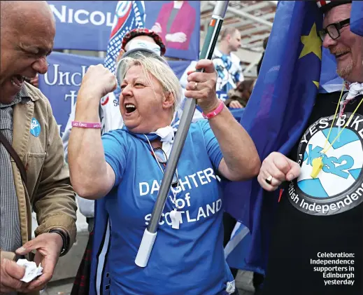  ??  ?? Celebratio­n: Independen­ce supporters in Edinburgh yesterday