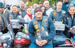  ?? JOURNAL ?? Marty Gagne enjoys the festivitie­s associated with another successful Duke City Toy Run, one of the many charities Marty helps organize for needy families every year. He was recently injured in a motorcycle crash but continues to try to organize...