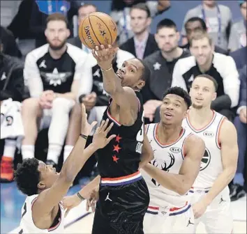  ?? Gerry Broome Associated Press ?? KEVIN DURANT captures his second All-Star game most-valuable-player award, as the Golden State Warriors superstar scores 31 points on 10-for-15 shooting to lead Team LeBron back from a big deficit.