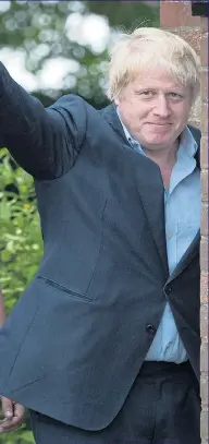  ??  ?? Boris waves to reporters outside his home yesterday while rival Theresa May attends church