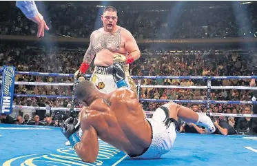  ?? Picture: Getty Images. ?? Anthony Joshua is sent to the canvas by a Ruiz punch in round three.