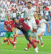  ?? REUTERS ?? ▪ Morocco's Aziz Bouhaddouz (No 20) scored an owngoal to hand Iran full points in their World Cup Group B opener on Friday.