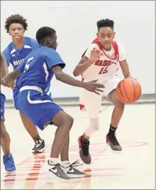  ?? Scott Herpst ?? Lakeview’s Jared Mitchell tries to dribble past Rossville’s Jamarion Burks during an NGAC contest last Tuesday night in Fort Oglethorpe.