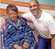  ?? [PHOTOS PROVIDED] ?? Hazel Bason, 107, of Oklahoma City, shares a few moments with Alan Washington, director of social services at Grace Living Center Wildewood.