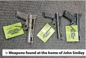  ?? ?? > Weapons found at the home of John Smiley
