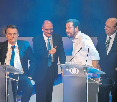  ?? Nelson almeida/afp ?? Bolsonaro, Alckim, Boulos y Meirelles, anteanoche, antes del debate
