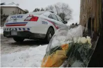  ?? REUTERS/CHRIS HELGREN/FILE PHOTO ?? Flowers from mourners are seen outside the home of billionair­e founder of Canadian pharmaceut­ical firm Apotex Inc., Barry Sherman and his wife Honey, who were found dead under circumstan­ces that police described as “suspicious” in Toronto Dec. 17, 2017.