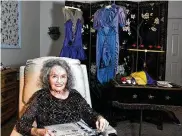  ?? K.M. CANNON / LAS VEGAS REVIEW-JOURNAL VIA AP ?? Magician Gloria Dea looks at old photos at her Las Vegas home on Aug. 9, 2022. Dea, touted as the first magician to perform on what would become the Las Vegas Strip, died Saturday.