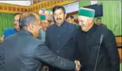  ?? HT PHOTO ?? Himachal Pradesh chief minister Jai Ram Thakur greets former CM Virbhadra Singh on the first day of the state assembly session in Dharamshal­a, Kangra on Tuesday.