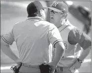  ?? AP file photo ?? Then-Nebraska coach Dave Van Horn argues with home plate umpire Joe Burleson on June 1, 2002, in an NCAA regional game against Marist in Lincoln, Neb. Van Horn resigned at Nebraska five days after the season to replace Norm DeBriyn as the Arkansas Razorbacks coach.
