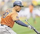  ?? Thearon W. Henderson / Getty ?? The Astros’ Carlos Gomez is not happywith his flyout to right field in the first inning of Saturday’sgame at Oakland, Calif. He went 0-for-3in the loss.