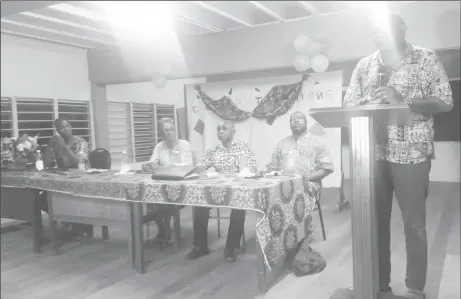  ??  ?? Nigel Hughes speaking yesterday. Seated from right are David Hinds and Carl Greenidge.