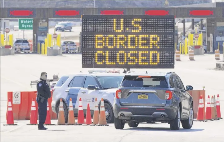  ?? Lars Hagberg / Getty Images ?? The Canadian land borders, which have been restricted due to the COVID pandemic, will remain closed for another 30 days, until April 21. The announceme­nt was made Thursday.