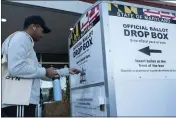  ?? JOSE LUIS MAGANA — THE ASSOCIATED PRESS FILE ?? A voter drops his ballot in a drop box at the Marilyn J. Praisner Community Recreation Center in Burtonsvil­le, Md., on Nov. 8.