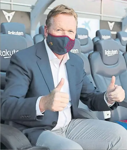  ?? FOTO: FCB ?? Koeman, con mascarilla, posa en el banquillo con el que ha soñado tantos años y en el que espera triunfar