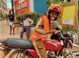  ?? ?? Allen Kisakye Butundu, a boda boda rider, earns up to £10 a day and is the main breadwinne­r for her family. Photograph: Courtesy of SafeBoda