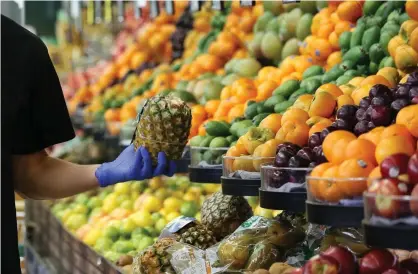  ?? Photograph: Fiona Goodall/Getty Images ?? Auckland supermarke­ts have witnessed polite stampedes as locals stock up on toilet paper and bananas