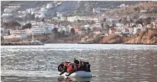  ?? ARIS MESSINIS, AFP/GETTY IMAGES ?? Migrants and refugees arrive at the northern island of Lesbos after crossing the Aegean Sea from Turkey in February.