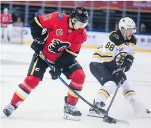  ?? GETTY IMAGES ?? Calgary Flames veteran winger Mikael Backlund, left, sees himself as one of the role models on the team as he prepares to begin his 10th season with the Flames.