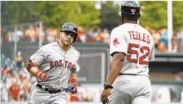  ?? PATRICK SEMANSKY/ASSOCIATED PRESS ?? The Red Sox’s Steve Pearce celebrates his solo homer in the first inning of a 4-1 win over the Orioles. Pearce helped Boston complete a four-game sweep.