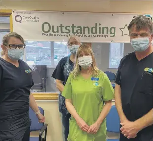  ?? ?? ABOVE: The High Sheriff of West Sussex, Dr Tim Fooks, with, from left, Dr Carole Campbell and Nurse Anna Harrison, both partners at Pulborough Medical Group, and Liz Eades, practice manager.
LEFT: One of the first patients to receive the vaccine