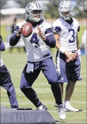  ?? TONY GUTIERREZ / AP ?? After serving as the Cowboys’ third-string quarterbac­k in OTAs last year, Dak Prescott (4) is getting all the work he wants in camp this spring. “The No. 1 way to get better is number of reps,” Prescott says.