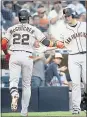  ?? KYUSUNG GONG – AP ?? Theo Giants’ Andrew McCutchen, left, celebrates his solo home run with Buster Posey during Sunday’s game.