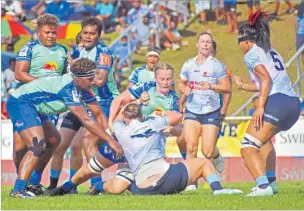  ?? Picture: ELIKI NUKUTABU ?? Fijian Drua Women lockforwar­d Jane Coates drives a Waratahs player back in a tackle at Churchill Park in Lautoka.