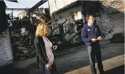  ??  ?? Left: Mary Beth Ludwig and Andrew Bailey, Anova co-founders and officials, at the still-damaged part of the campus.