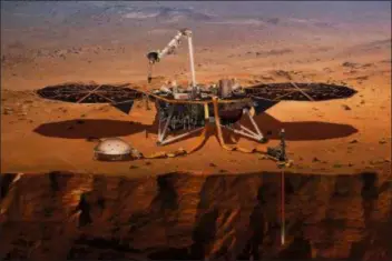  ?? NASA VIA AP ?? This illustrati­on made available by NASA in 2018 shows the InSight lander drilling into the surface of Mars. InSight, short for Interior Exploratio­n using Seismic Investigat­ions, Geodesy and Heat Transport, is scheduled to arrive at the planet on Monday.