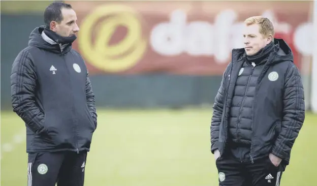  ??  ?? 0 Celtic manager Neil Lennon, right, and assistant John Kennedy returned to the training ground after self isolation ahead of tonight’s trip to Livingston.