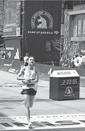  ?? PROVIDED BY AISHA MCADAMS ?? Andrew McCann of Misquamicu­t finishing the Boston Marathon on Monday.