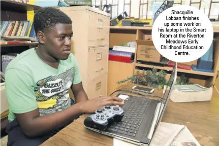  ??  ?? Shacquille Lobban finishes up some work on his laptop in the Smart Room at the Riverton Meadows Early Childhood Education Centre.