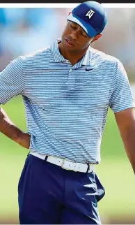  ?? GETTY IMAGES ?? Suffering: Woods after his seven