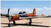  ??  ?? Here a full-size Tucano T-27 shows off its commemorat­ive paint scheme used by the Brazilian Air Force. (Photo via Wiki Commons)