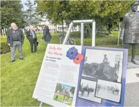  ?? Photos / Warren Buckland ?? The newest addition to Hastings Civic Square is a bright purple placard of remembranc­e to animals that served in the war.