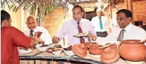  ??  ?? Harry Jayawarden­a, Niranjan Deva Aditiya , Sanath Ukwatte and Rajan Britto enjoying the meals