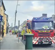  ?? (Pic: Marian Roche) ?? The fire brigade attended the scene of an ESB pole fire recently on Lower Cork Street, Mitchelsto­wn.