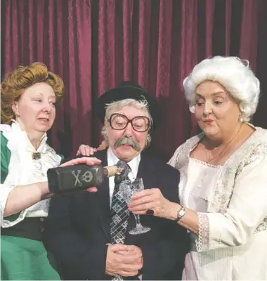  ?? PHOTO BY RANDY FORESTER ?? Sisters Martha, left, and Abby Brewster, right, portrayed by Becki Jordan and Coylee Bryan, respective­ly, pour some elderberry wine for Mr. Witherspoo­n, portrayed by Denise Frye, in the classic comedy “Arsenic and Old Lace,” which opens Friday at Oak Street Playhouse.