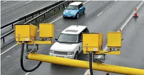  ??  ?? Average speed cameras, such as these United Kingdom units, successful­ly reduced the number of fatal crashes overseas.
