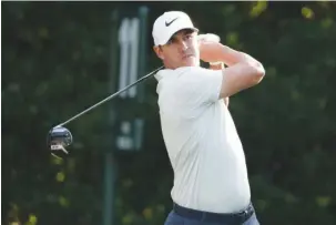  ?? The Associated Press ?? U.S. OPEN WINNER RETURNS: Brooks Koepka hits from the 11th tee Thursday during the first round of The Players Championsh­ip in Ponte Vedra Beach, Fla.