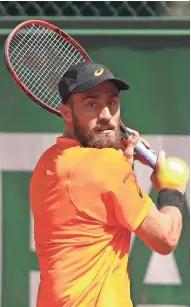  ?? GETTY IMAGES ?? Steve Johnson gets ready to unleash a backhanded return during his four-set win over Borna Coric in the second round.