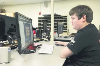  ?? SARAH GONSER — THE ASSOCIATED PRESS ?? A student works on a computer during a career and technical education class at theManches­ter School of Technology in Manchester, N. H. Career and technical education is viewed as a gateway to good jobs, but a new analysis on enrollment data from 40states finds a deep racial divide in who benefits. The analysis shows Black and Latino students were often less likely than their white peers to enroll in science, technology, engineerin­g and math and informatio­n technology classes.